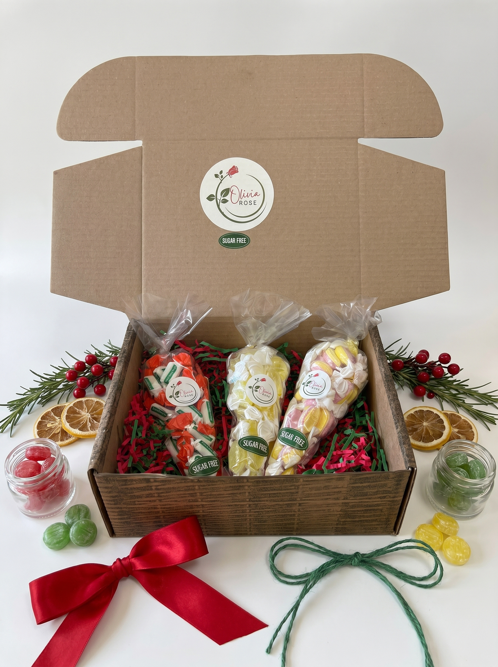 Gift box with sugar free sweet cones and decorations on a white background