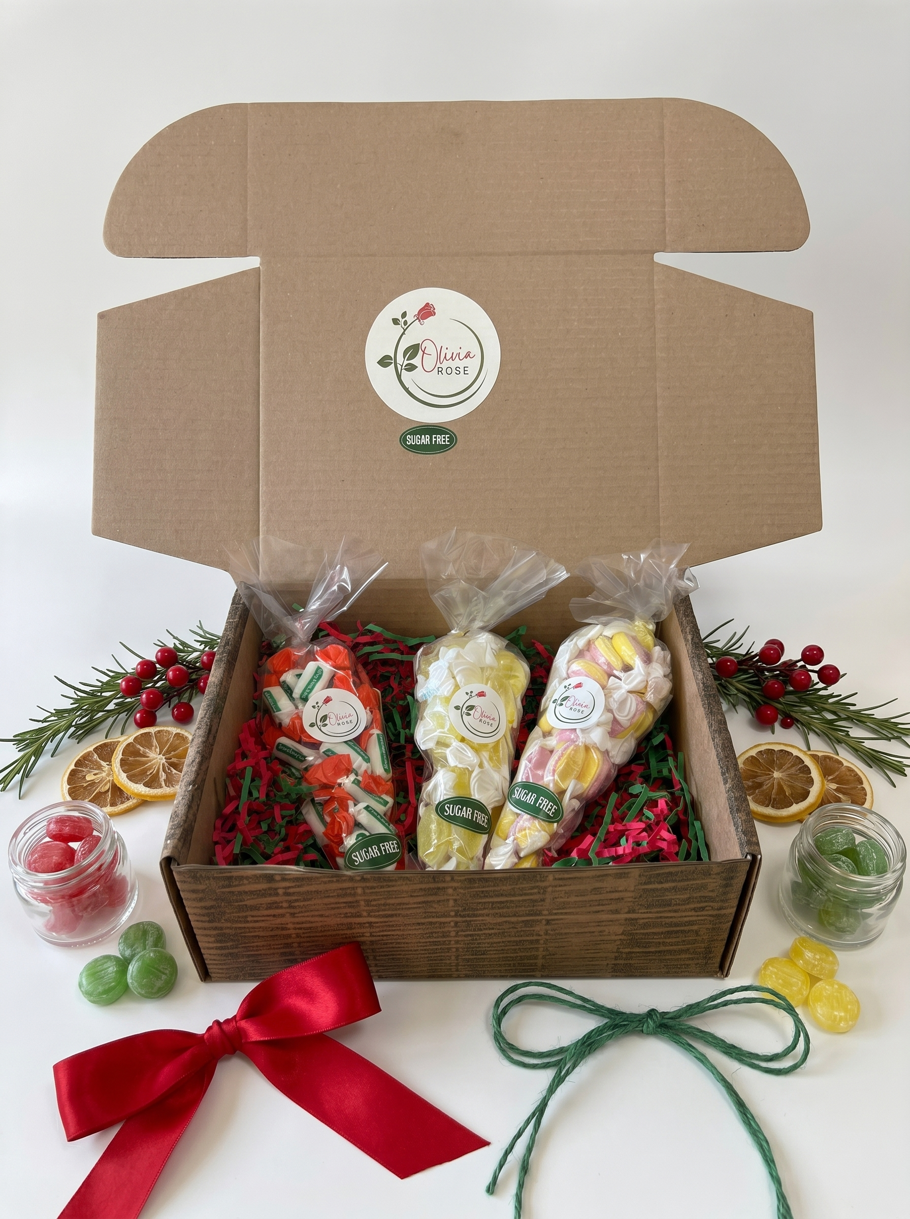 Gift box with sugar free sweet cones and decorations on a white background